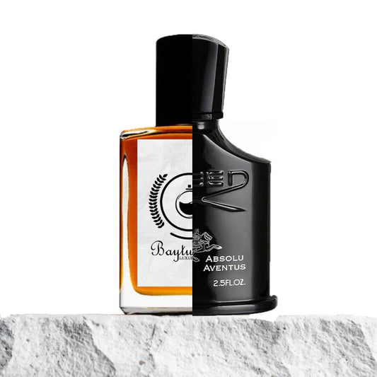 Image of a split design featuring two different perfume bottles: the left half showcasing a Baytulkenz perfume bottle with an amber-colored liquid and a white label, and the right half displaying a black Creed Absolu Aventus bottle with silver text. Both bottles are placed on a textured white stone surface with a clean white background.