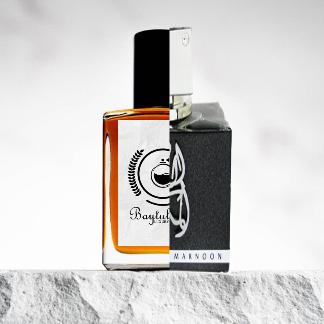 "A perfume bottle with a black cap and the 'Baytul' luxury logo, positioned on the left side on a textured surface."
 "On the right, a perfume bottle of Al Dur Al Maknoon Silver by Lattafa."
 "The two bottles are placed side by side, highlighting their distinct designs."
 "The textured surface beneath the bottles adds depth and contrast to the image."
 "Both bottles are elegantly displayed with the logo and design features clearly visible."