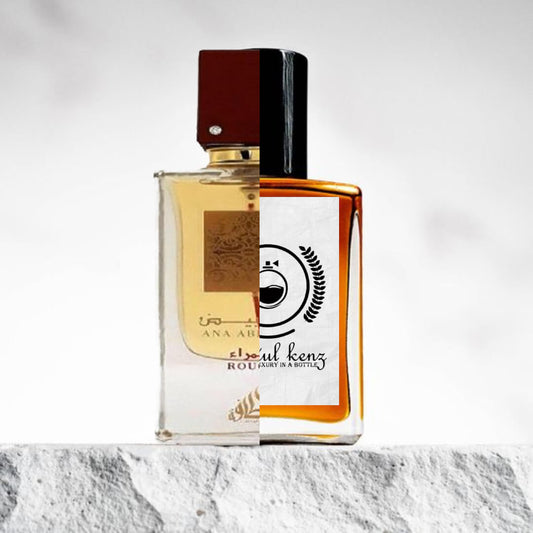 "Two elegant perfume bottles are displayed side by side against a light background."
"On the left, Ana Abiyedh Rouge by Lattafa, featuring a refined design with a distinctive label."
"The bottle has a sleek, modern shape with a clear label that highlights the fragrance name."
"On the right, an inspired version of Ana Abiyedh Rouge by Baytulkenz, echoing the original design."
"The inspired bottle mirrors the shape and aesthetic of the original, with a unique twist on the label and branding."