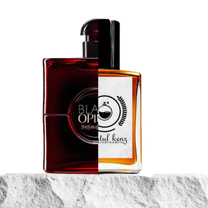 "A split image features two perfume bottles displayed side by side."
"On the left, a dark red bottle labeled "Black Opium Over Red" by Yves Saint Laurent."
"The bottle has a bold, deep red hue with a modern, sleek design and a prominent label."
"On the right, a gold bottle with a branded logo, the Baytulkenz inspired version of Black Opium Over Red by Yves Saint Laurent."
"The gold bottle features a luxurious, metallic finish with a distinctive logo and refined design."