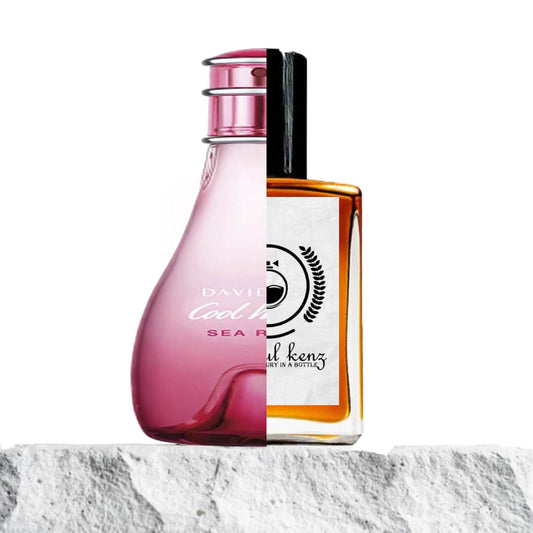 "A split image showcases two perfume bottles displayed side by side."
"On the left, a pink bottle labeled "Davidoff Cool Water Sea Rose", featuring a soft, feminine design with a delicate pink hue."
"The Davidoff Cool Water Sea Rose bottle has a sleek, elegant shape with a fresh, inviting appearance, perfect for a floral and aquatic fragrance."
"On the right, an amber bottle labeled "Baytulkenz", the inspired version of Davidoff Cool Water Sea Rose."
"The amber bottle has a warm, rich color design."