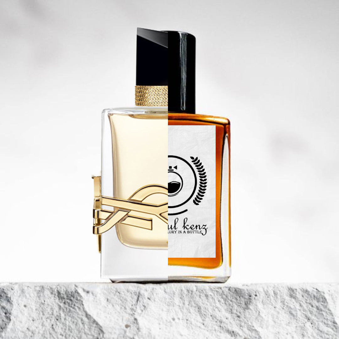 "A split image of two perfume bottles displayed side by side."
"On the left, a clear bottle with a gold accent, labeled Libre Yves Saint Laurent, exuding an elegant and luxurious design."
"On the right, an amber bottle with a logo, representing the Baytulkenz inspired version of Libre Yves Saint Laurent."
"The Baytulkenz bottle features a refined design with subtle differences in color and branding."
"Both bottles are set on a textured background."