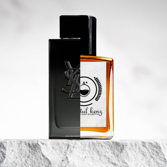 "Two perfume bottles are displayed on a textured surface."
"On the left, a sleek black bottle labeled MYSLF Yves Saint Laurent, featuring a modern and bold design."
"On the right, a transparent bottle with orange liquid, representing the Baytulkenz inspired version of MYSLF Yves Saint Laurent."
"The Baytulkenz bottle offers a refined, elegant look with the vibrant orange liquid, contrasting with the bold black of the original."