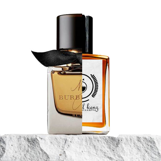 "Two contrasting perfume bottles are displayed side by side against a plain white background."
"On the left, a bottle labeled My Burberry Black, featuring a gold liquid and a black cap, exuding a sophisticated and luxurious design."
"On the right, a Baytulkenz perfume bottle, an inspired version of My Burberry Black, with a similar sleek design but distinct branding."
"The Baytulkenz bottle mirrors the elegance of the original, with a warm, amber-colored liquid and refined styling."