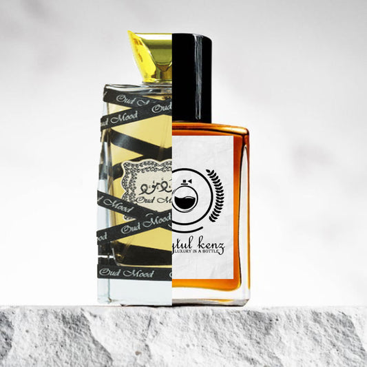 "Two different perfume bottles are placed on a white ledge with a marble pattern."
"On the left, a lemon-colored bottle with black stripes and a label that reads "Oud Mood Lattafa" stands with a bold, eye-catching design."
"On the right, an amber-colored bottle with a white label represents the Baytulkenz inspired version of "Oud Mood Lattafa."
"The lemon-colored bottle contrasts with the warm amber tone of the inspired version, each showcasing unique design elements."