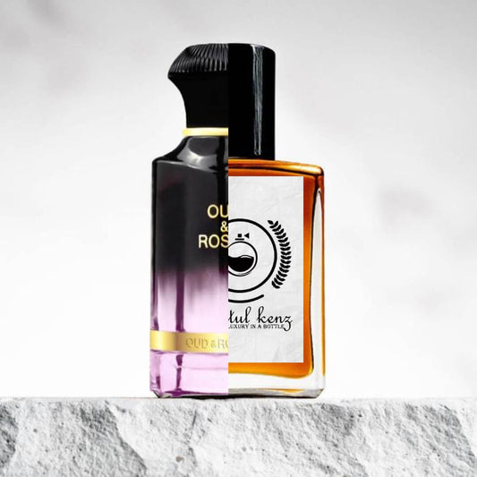 Split image displaying two perfume bottles: the left side shows an Ahmed Al Maghribi Oud & Roses bottle with a gradient black-to-purple design and a sleek black cap, while the right side features a Baytulkenz bottle with a clean white label, black cap, and amber liquid. Both are set against a textured stone surface and a neutral background.