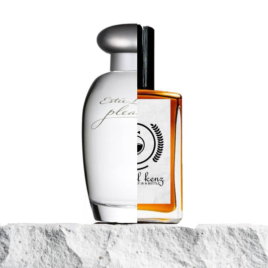 "Two perfume bottles are placed on a stone surface."
"On the left, an opaque white bottle labeled "Pleasures Estée Lauder" has a sleek, minimalist design."
"On the right, a transparent bottle with amber liquid represents the Baytulkenz inspired version of "Pleasures Estée Lauder."
"The white bottle provides a soft, clean look, while the amber liquid in the transparent bottle adds warmth and depth."