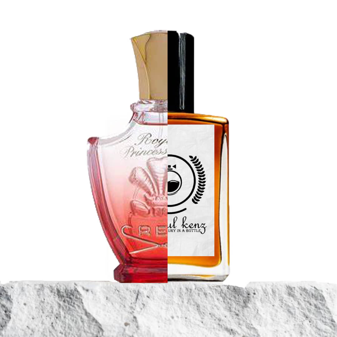 "Two perfume bottles are displayed side by side, split down the middle against a white background."
"On the left, a mild red and transparent bottle labeled "Royal Princess Oud Creed" features a refined, elegant design."
"On the right, the Baytulkenz inspired version of "Royal Princess Oud Creed" is displayed in a matching shape, offering a similar yet distinct design."
"The red bottle contrasts with the more neutral design of the inspired version, showcasing the differences between the two."