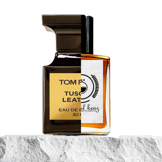 "A split image of two perfume bottles displayed against a stone background."
"On the left, a black-colored bottle with a gold label reading "Tom Ford Tuscan Leather."
"On the right, an amber-colored bottle representing the Baytulkenz inspired version of "Tom Ford Tuscan Leather."
"The black bottle features a luxurious design with gold detailing, while the amber bottle offers a warm, rich contrast."